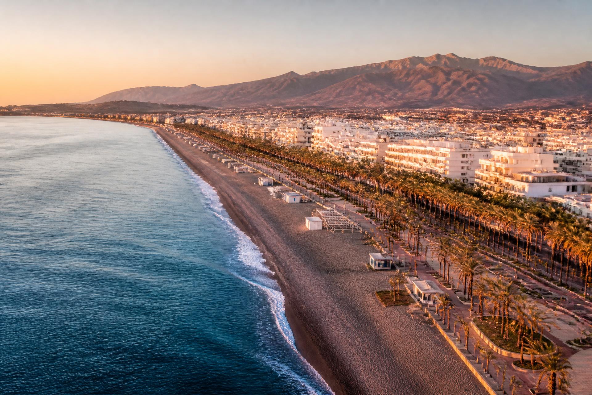 Aerial view of Torre del Mar beach and Sierra Tejeda at golden hour